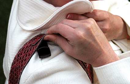 Shoulder Houlder easily attaches to most any top, coat or jacket to keep straps on your shoulder where they belong without effecting the garment to which it's attached.