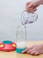 Add 1-1/2 cups of hot tap water into bottle